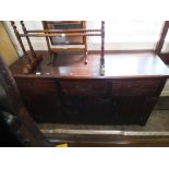 A mahogany sideboard with iron hinges and panel doors