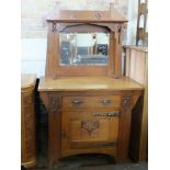 An Art Nouveau oak mirror back sideboard