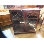 A mahogany glazed two door cabinet