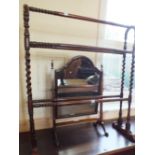 A Victorian mahogany barley twist towel rail and a swing toilet mirror