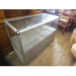 An aluminium and glazed shop display cabinet,