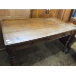 A Victorian oak two drawer side table on barley twist supports