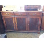 A reproduction yew and mahogany three door sideboard and a corner cabinet