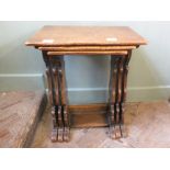 A nest of three oak tables marked Teeangee,