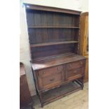 A 1920's oak shelf back dresser