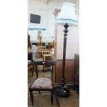 A Victorian carved mahogany dining chair and fluted column standard lamp