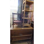 An oak chest of three long drawers, a wrought iron standard lamp,