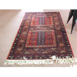 A machine made Kashan rug,