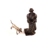 A small bronze figure of an Edwardian lady in a fur coat stamped 'Real Vienna Bronze',