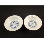 A pair of 19th Century Oriental porcelain moulded blue and white flared bowls