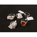 A group of five silver stone set rings including amethyst, pearl,