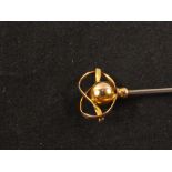 A 9ct gold Charles Horner hat pin in the form of a ball and knot