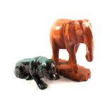 A carved wooden elephant and a Canadian Blue Mountain dog