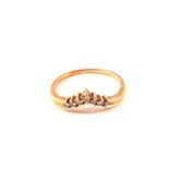 A 9ct gold seven diamond half wishbone ring,