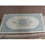 A floral runner and rug plus an Indian blue and cream floral rug