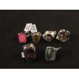 A group of six silver stone set rings including quartz,