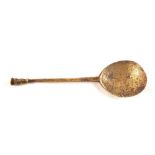 A 17th Century brass seal top spoon with tapering stem and plain seal top,