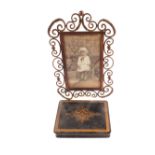 A Victorian black and gilt papier mache box plus a brass strut photo frame