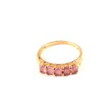 A 9ct gold five pink stone ring,