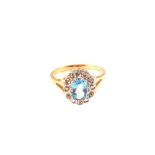 A 9ct gold topaz and diamond ring,