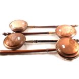 Four Victorian copper warming pans