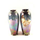 A pair of blue lustre butterfly decorated vases (one restored bottom rim)