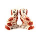 A pair of Victorian Staffordshire russet dogs