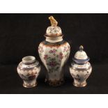 A Samson lidded vase with armorial plus a pair of smaller vases (one missing lid)