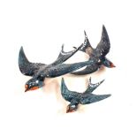 A set of three Beswick swallow wall plaques