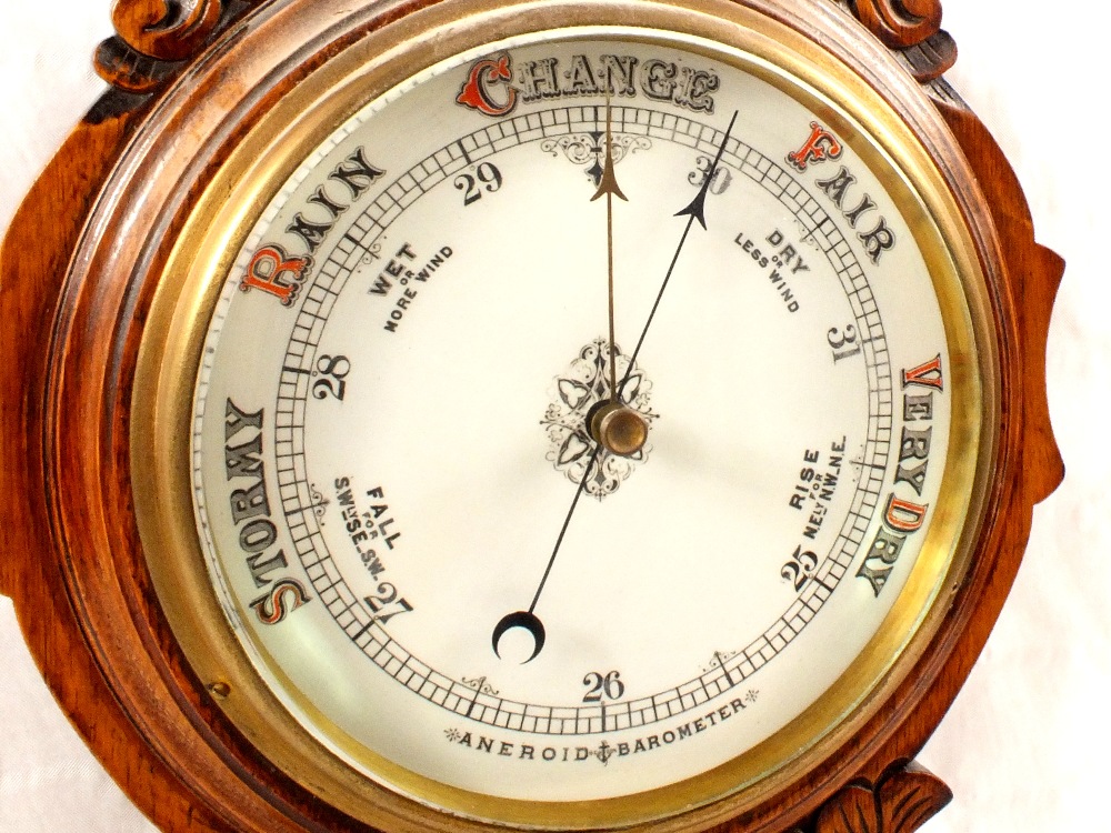 An aneroid barometer in carved oak case - Image 2 of 2