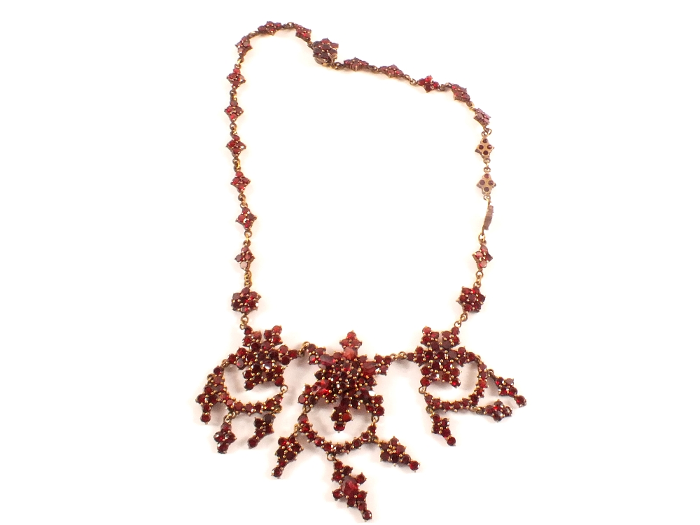 An ornate Victorian cut garnet necklace