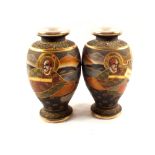 A pair of Satsuma figure decorated vases,