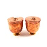 A pair of Victorian copper ice cream moulds each with screw on brass foot and stamped Jones Bros,