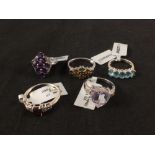 A group of five silver stone set rings including amethyst, apatite,