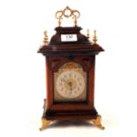A mahogany gilt metal mantel clock