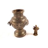A 19th Century Chinese brass vase with dragon decoration (missing handles) plus a brass figure of a