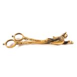 A pair of antique brass scissor candle snuffers cast in the form of a stylised cat