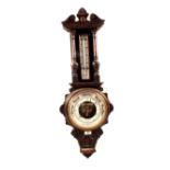 An aneroid barometer in floral and shell carved oak case, signed Aitchison & Co, Optician to HM Gov,