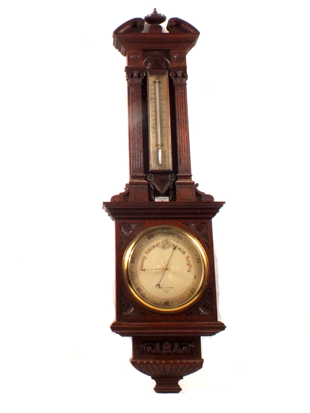 A 19th Century Negretti & Zambra aneroid barometer in carved oak architectural case, No.