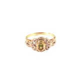 A 9ct gold peridot and diamond ring,