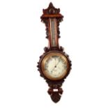 An aneroid barometer in leaf carved oak case, signed Benetfink & Co,