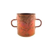 An Arts and Crafts copper loving cup with embossed leaf decoration