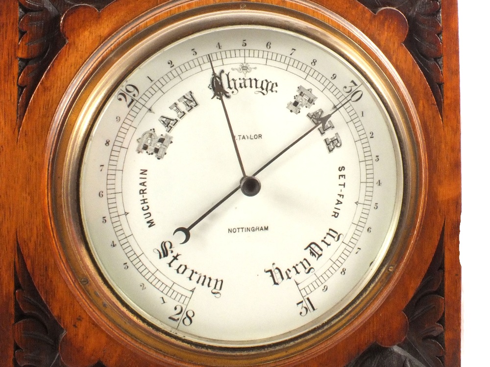 An aneroid barometer in carved oak case with eagle mount, signed J. - Image 2 of 2