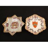 Two Samson shaped edge dishes with armorials