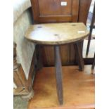 An antique elm stool,