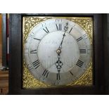 A late 18th Century 30 hour long case clock, with figured oak case, square face marked John How,