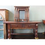 A nest of three oak tables and a two drawer coffee table