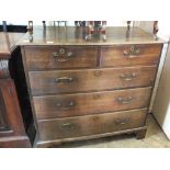 A late 18th/early 19th Century oak chest of two short and three long drawers on bracket feet