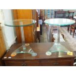 A pair of contemporary circular glass occasional tables (one as found)