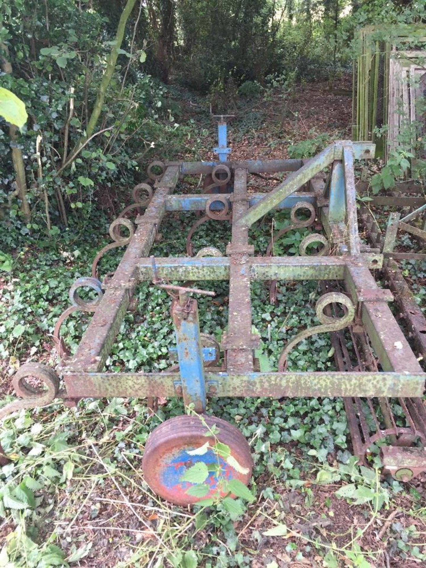 H Blyth a 10ft, 13 tine (pig tail) cultivator with three point linkage, with depth wheels.